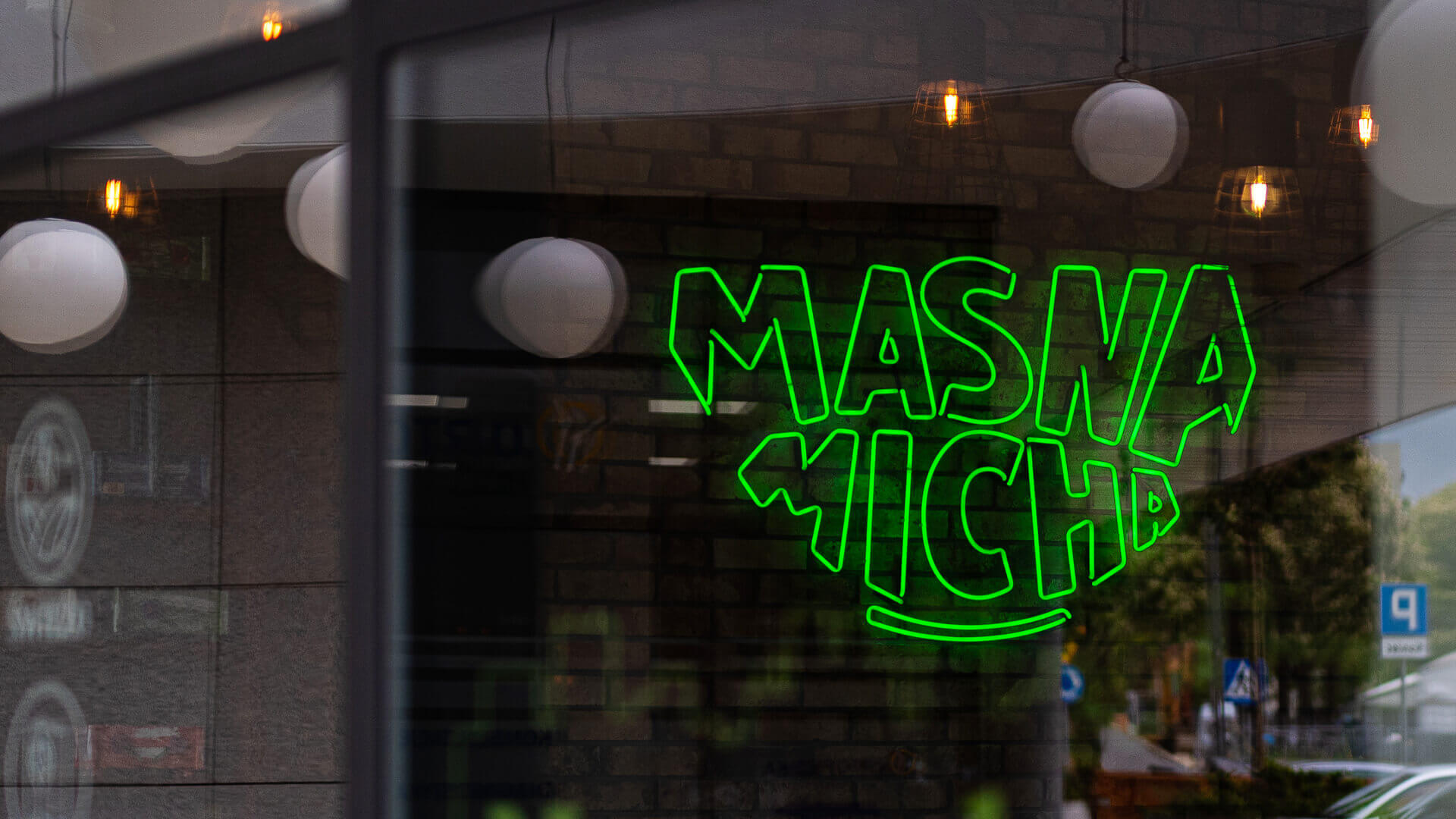 Neon sign for Masna Micha restaurant in Gdansk, Poland, on the premises.